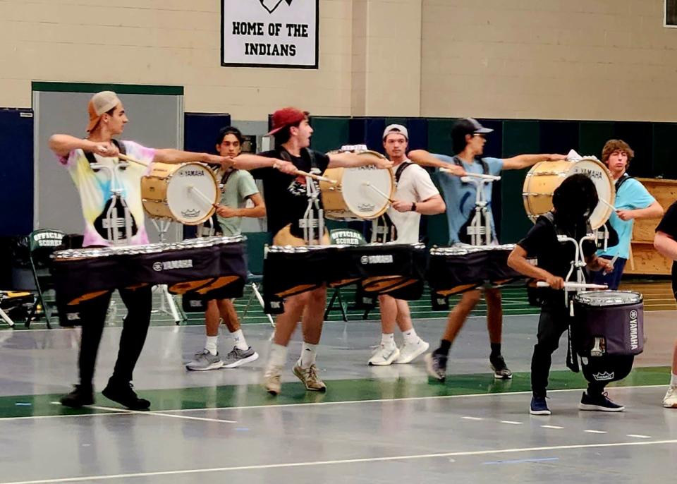 The Dartmouth High School Band's drumline practices in the gymnasium Thursday evening. The band members are in the process of learning their new 2023 routine.