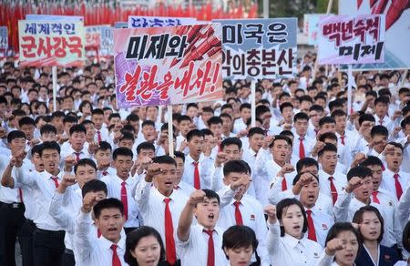 An anti-U.S. rally at Kim Il Sung Square is seen in this September 23, 2017 photo released by North Korea's Korean Central News Agency (KCNA) in Pyongyang on September 24, 2017. Placards read (L-R) "A global military power", "Be through with the U.S.", "The U.S. is evil's headquarters", "Old foe the U.S." KCNA/via REUTERS