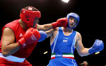 LONDON, ENGLAND - AUGUST 06: Roberto Cammarelle of Italy (R) in action with Mohammed Arjaoui of Morocco during the Men's Super Heavy ( 91kg) Boxing on Day 10 of the London 2012 Olympic Games at ExCeL on August 6, 2012 in London, England. (Photo by Scott Heavey/Getty Images)