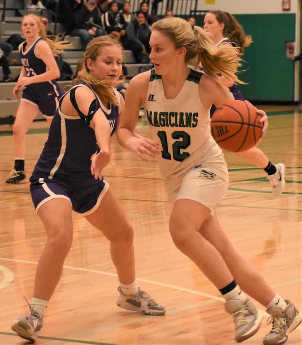 Herkimer Magician Madison Marusic (12) drives against West Canada Valley Indian Bella Borden Dec. 2, 2022.
