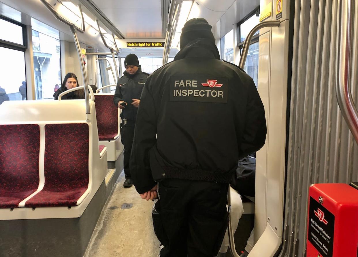 Twenty TTC fare inspectors and special constables will begin wearing body-worn cameras as part of a pilot project in the second quarter of 2024. (John Rieti/CBC - image credit)