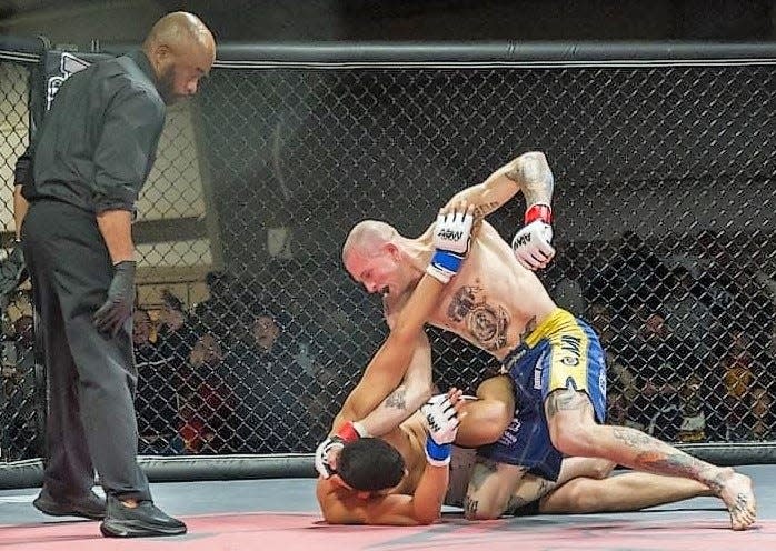 Elco wrestling coach Ben Moser, top, is also a mixed martial arts fighter. Since going pro in 2018, Moser is 2-1 in cage fights.