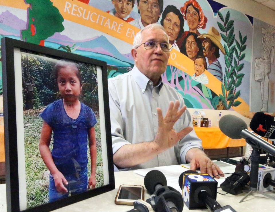Annunciation House director Ruben Garcia answers questions from the media after reading a statement from the family of Jakelin Caal Maquin, pictured at left, during a news conference Saturday, Dec. 15, 2018, at Casa Vides in Downtown El Paso.