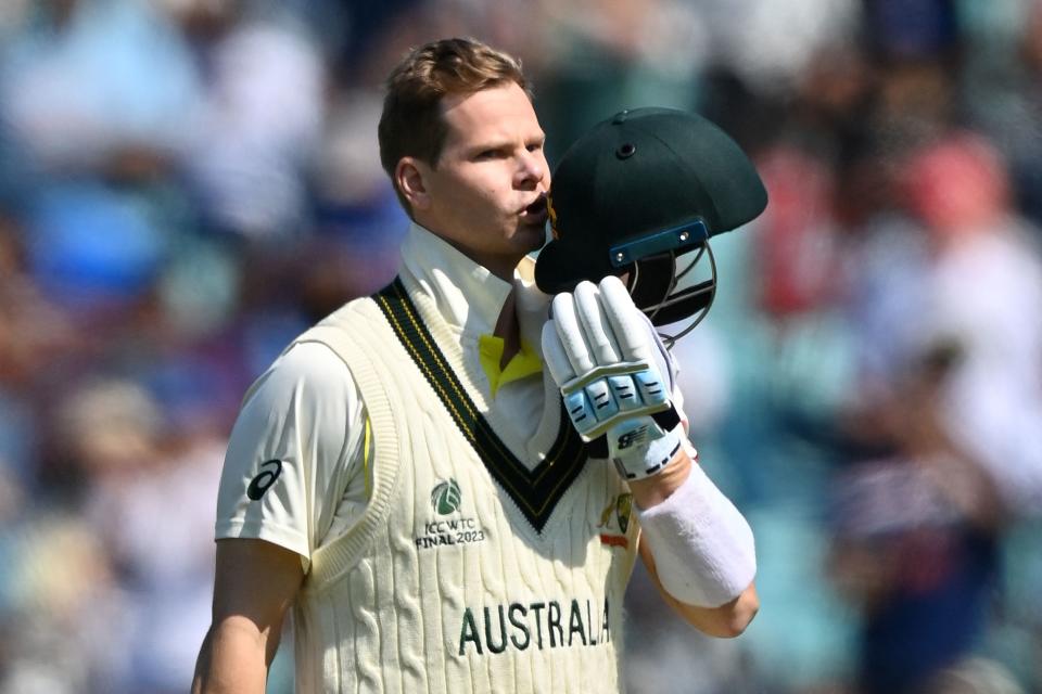 Steve Smith kisses his helmet after scoring a century.