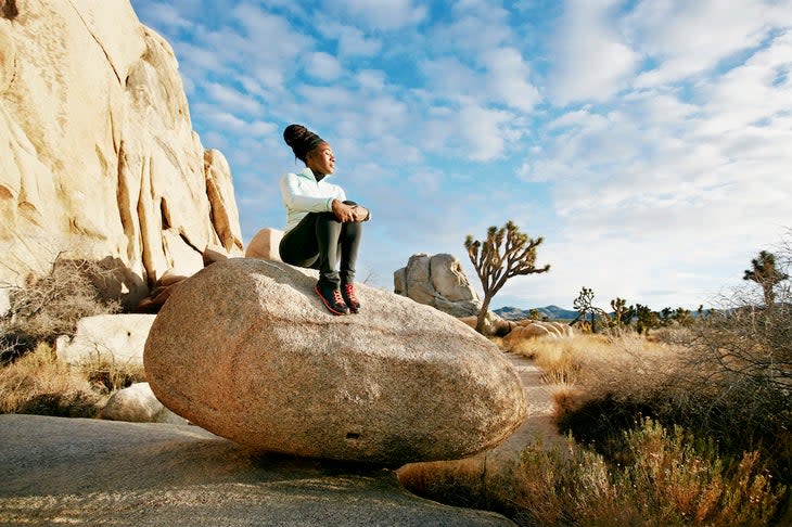 Black runner in desert landscape, Joshua Tree National Park, California, United States