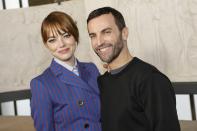 Emma Stone, left, and designer Nicolas Ghesquiere pose for photographers prior to the Louis Vuitton Fall/Winter 2023-2024 ready-to-wear collection presented Monday, March 6, 2023 in Paris. (Vianney Le Caer/Invision/AP)