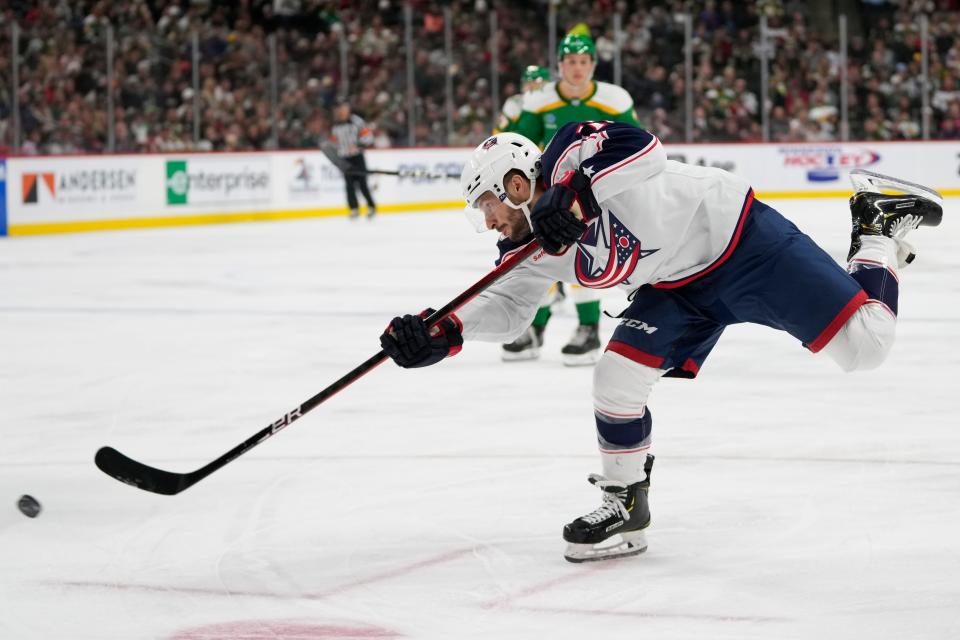 Columbus Blue Jackets right wing Justin Danforth shoots during the third period of an NHL hockey game against the Minnesota Wild, Saturday, Oct. 21, 2023, in St. Paul, Minn. (AP Photo/Abbie Parr)