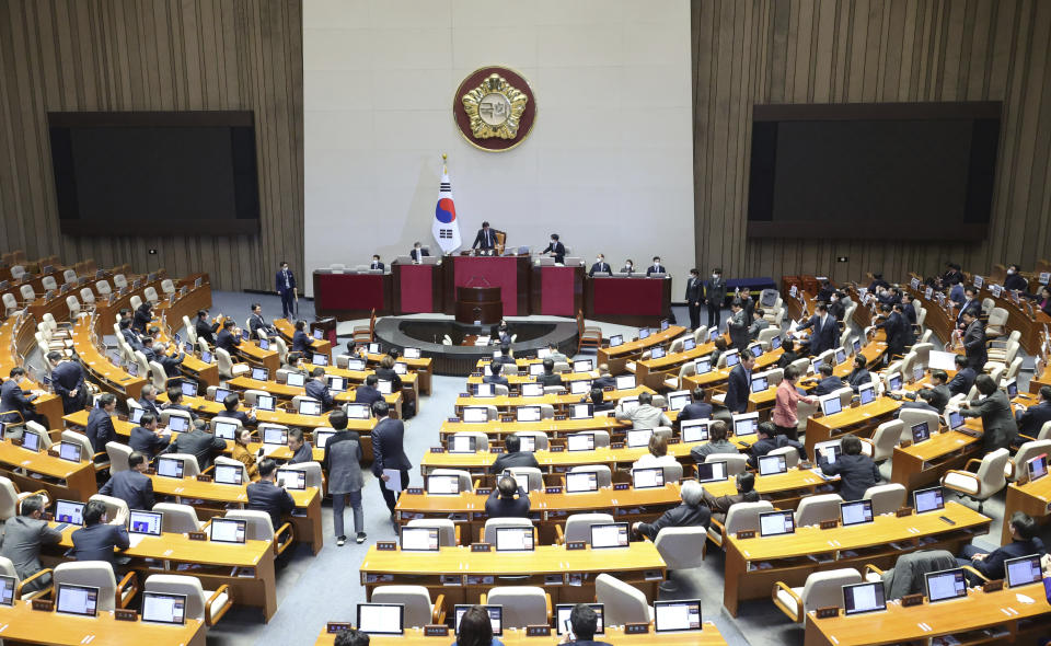 South Korean lawmakers pass a motion to impeach Interior and Safety Minister Lee Sang-min during a plenary session at the National Assembly in Seoul, South Korea, Wednesday, Feb. 8, 2023. South Korea's opposition-controlled parliament on Wednesday voted to impeach Lee holding him responsible for government failures in disaster planning and the response that likely contributed to the high death toll of a crowd crush that killed nearly 160 people in October. (Lee Jung-hun/Yonhap via AP)