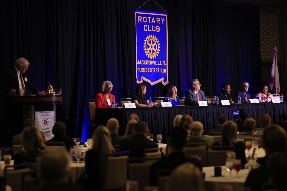 The Rotary Club of Jacksonville hosted a forum for candidates running to be mayor on Nov. 21, 2022, at the Marriott Jacksonville Downtown. Those who participated were Omega Allen, in red from left, LeAnna Cumber, Donna Deegan, Al Ferraro, Audrey Gibson, Frank Keasler and Theresa Ann Richardson. Hank Coxe, a past president of the Rotary Club and The Florida Bar, moderated at far left.