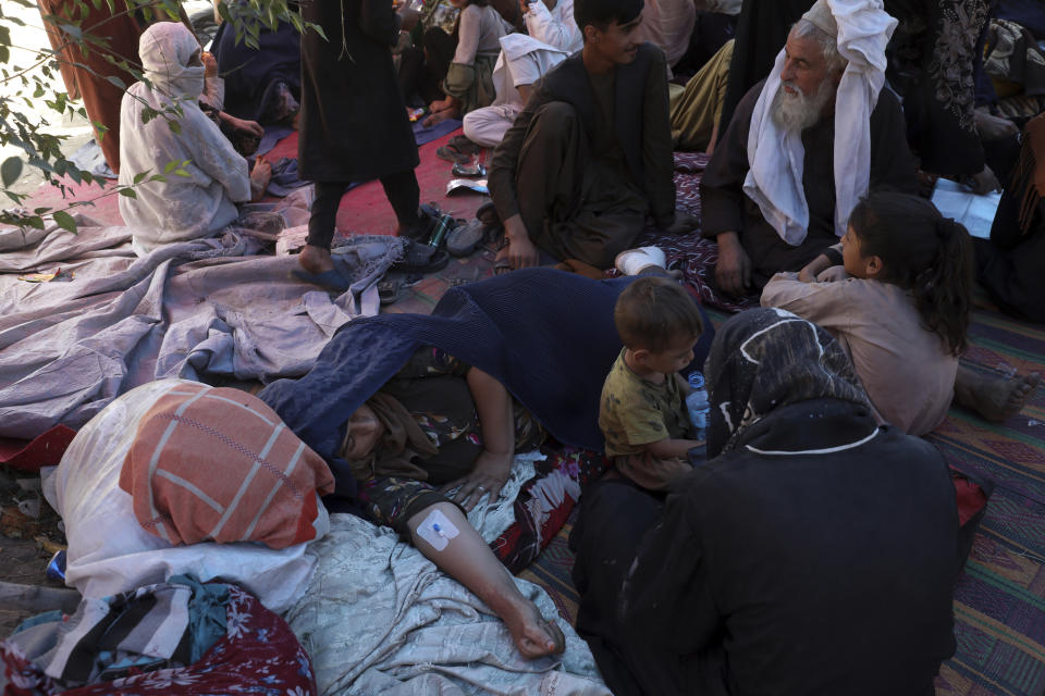 Internally displaced Afghan women from northern provinces, who fled their home due to fighting between the Taliban and Afghan security personnel, receive medical care in a public park in Kabul, Afghanistan. Source: AP Photo/Rahmat Gul