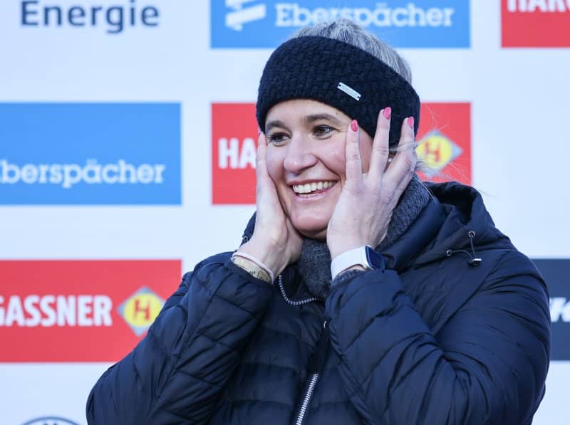 Natalie Geisenberger reacts at her farewell ceremony. The most successful German Winter Olympic athlete has ended her career and was given a ceremonial farewell on the same day. Jan Woitas/dpa