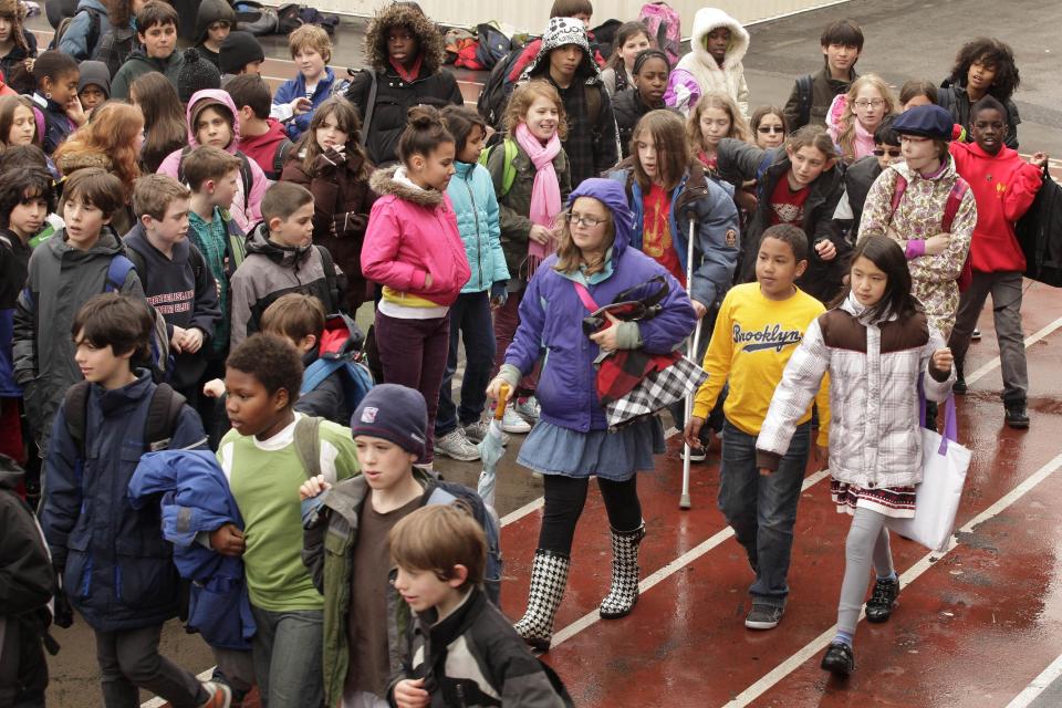 In this April. 1, 2011 photo, New York City fifth graders enter PS321, a public elementary school in the Brooklyn Borough of New York. New York state has the most segregated public schools in the nation, with many black and Latino students attending schools with virtually no white classmates, according to a report released Wednesday, March 26, 2014, by the Civil Rights Project at the University of California at Los Angeles. (AP Photo/Mark Lennihan)