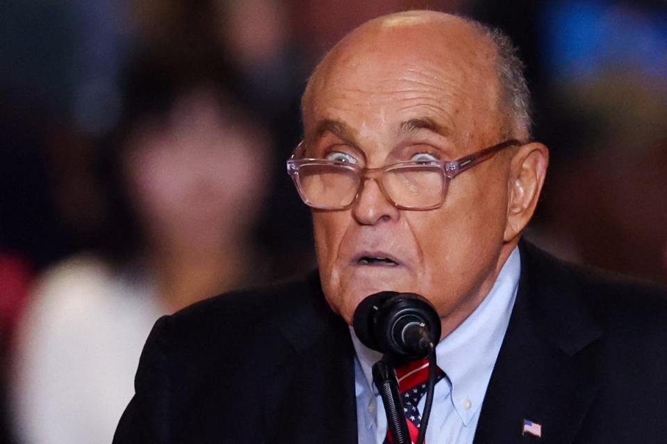 Rudy Giuliani at a Trump rally earlier this month. His daughter endorsed Kamala Harris in a rebuke to him (REUTERS)