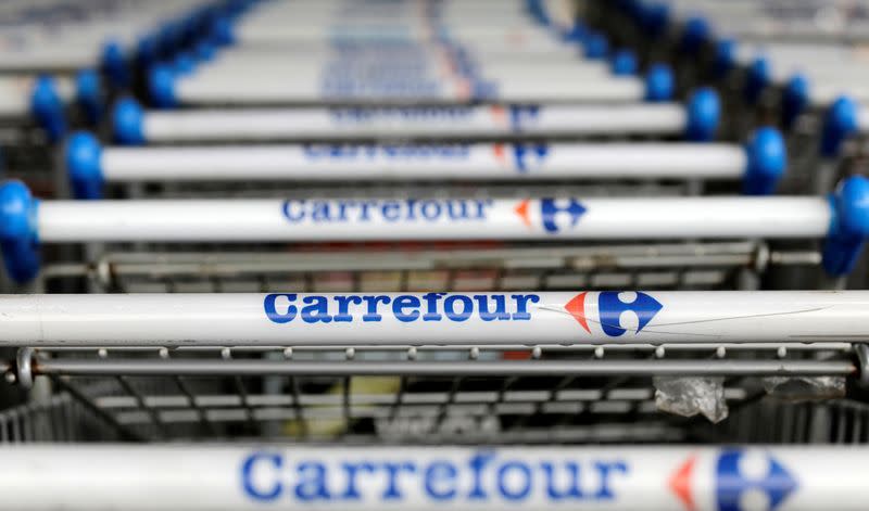 FILE PHOTO: The logo of France-based food retailer Carrefour is seen on shopping trolleys in Sao Paulo