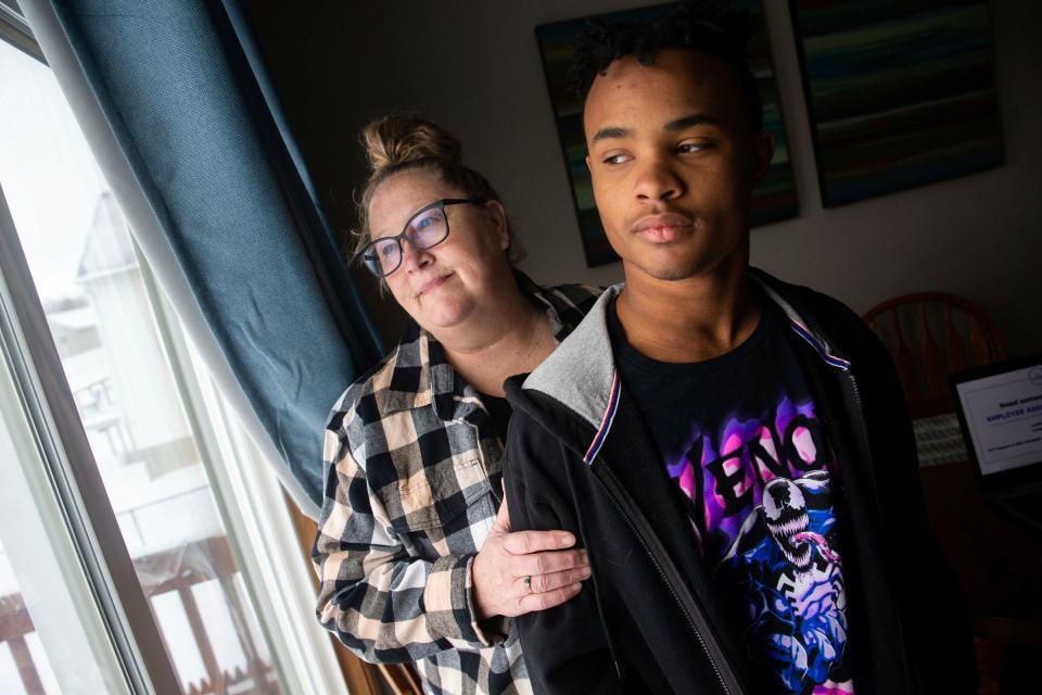 Deidra and her son Ricco Artecki pose for a portrait Friday, Feb. 17, 2023, at their Cedar Springs home. Artecki had been unable to get answers about the court fees that she and her other son would owe after he was charged with felonius assault and truancy in 2022. Legislation being considered in Michigan's Legislature would wipe out juvenile court debt and stop courts from charging discretionary fines and fees.
(Credit: Cody Scanlan, Holland Sentinel)