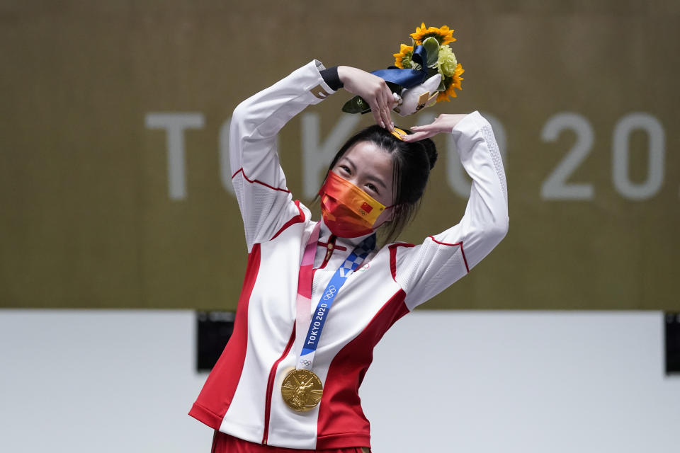 Yang Qian, of China, reacts after winning the gold medal in the women's 10-meter air rifle at the Asaka Shooting Range in the 2020 Summer Olympics, Saturday, July 24, 2021, in Tokyo, Japan. (AP Photo/Alex Brandon)