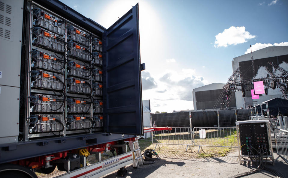 Electric truck batteries charged up with wind turbine energy parked outside of a Denmark concert venue.<span class="copyright">Vestas Wind Systems A/S</span>