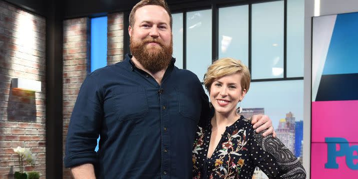 erin and ben napier smiling as they visit the set of people