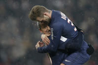 Paris Saint-Germain's David Beckham (R) congratulates Zlatan Ibrahimovic after his goal against Olympic Marseille in their French Ligue 1 soccer match at Parc des Princes stadium in Paris February 24, 2013. REUTERS/Gonzalo Fuentes (FRANCE - Tags: SPORT SOCCER TPX IMAGES OF THE DAY) - RTR3E8D9