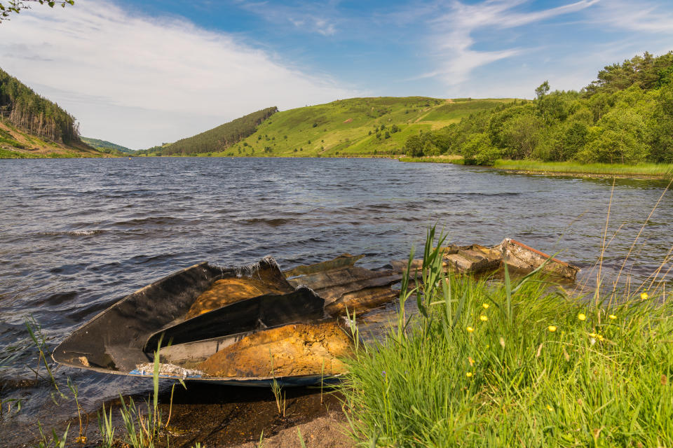 View over Llyn Geirionydd, near Llanwrst, Conwy, Wales, UK - with a damaged boat in the foreground