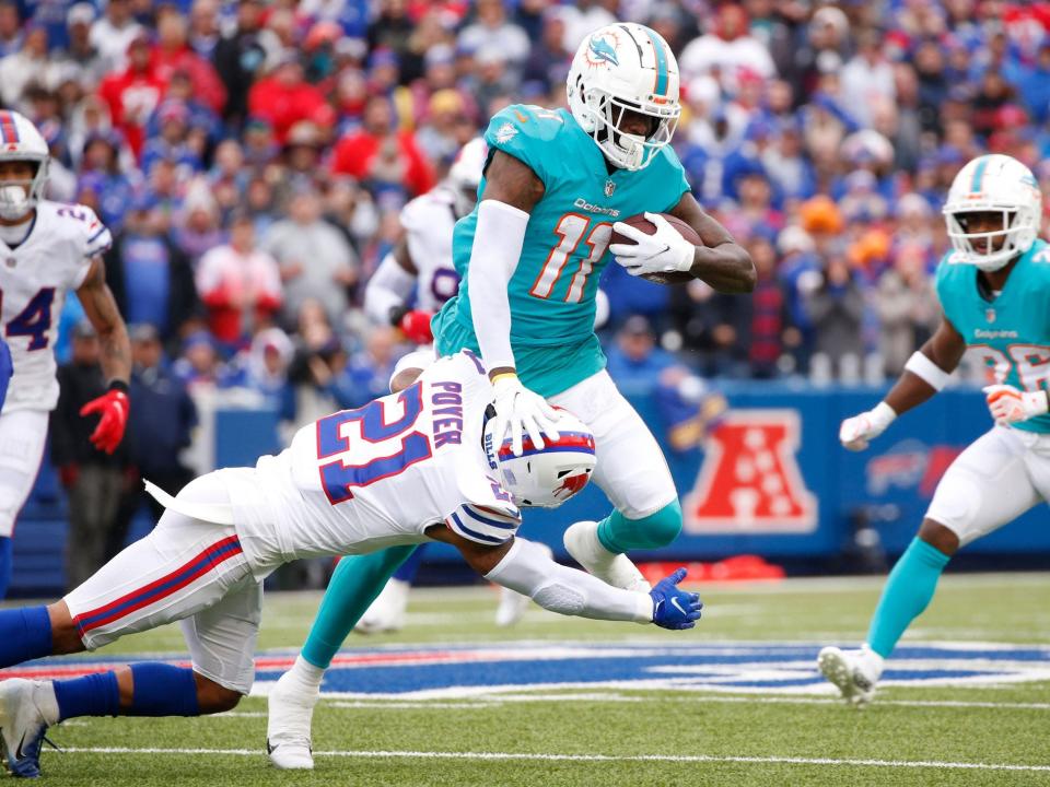 DeVante Parker hurdles a defender against the Buffalo Bills.