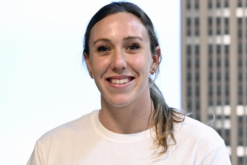 U.S. Olympic swimmer Abbey Weitzeil poses for the media at the Empire State Building on Tuesday, Aug. 3, 2021, in New York. Abbey Weitzeil will take on some new responsibilities at the Paris Olympics. Leader. Mentor. A shoulder to cry on. (Photo by Evan Agostini/Invision/AP, File)