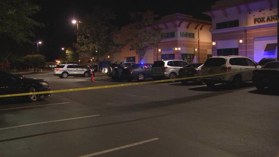 In this image from WSOC, Police tape closes off a crime scene following a fatal shooting outside a north Charlotte restaurant on Tuesday, October 5, 2022.