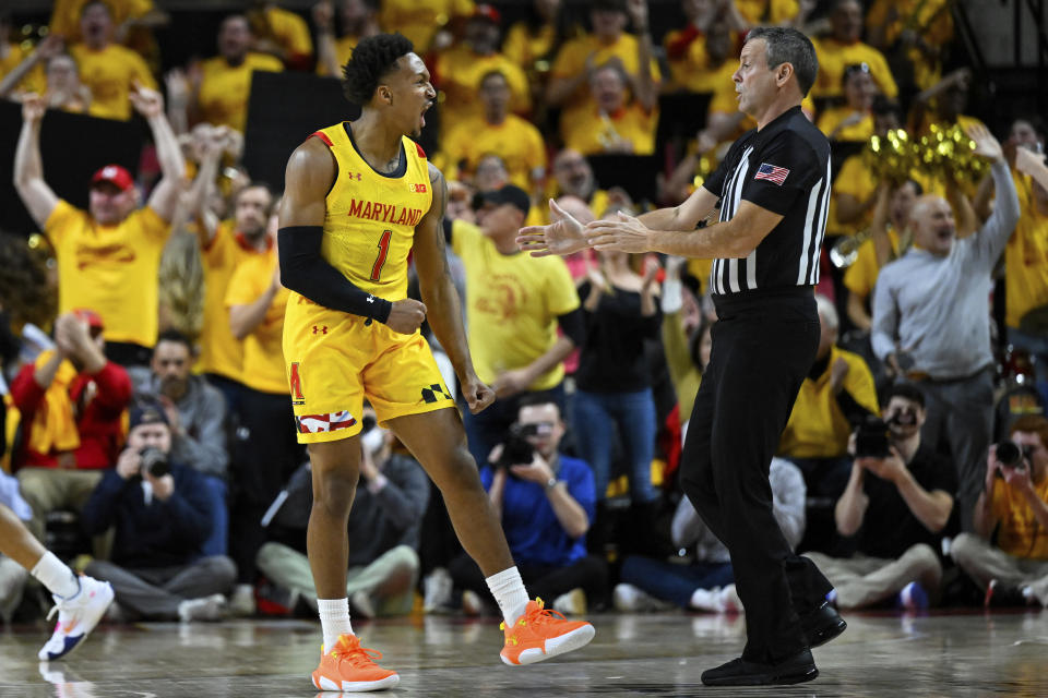 Maryland guard Jahmir Young (1) reacts after making a 3-point basket during the first half of an NCAA college basketball game against Illinois, Friday, Dec. 2, 2022, in College Park, Md. (AP Photo/Terrance Williams)