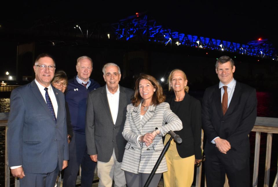 Celebrating the inaugural lighting of the Braga Bridge on Tuesday in Fall River from left are state Sen. Michael Rodrigues, city councilor Linda Pereira, Mayor Paul Coogan, state Rep. Alan Silvia, Lt. Gov. Karyn Polito, state Rep Carole Fiola and Jamey Tesler, Massachusetts Department of Transportation Chief Secretary of Transportation. 