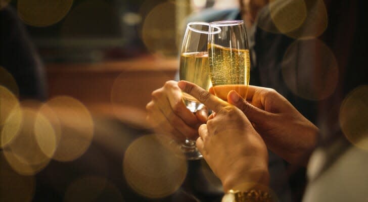 Couple toasting their retirement with champagne