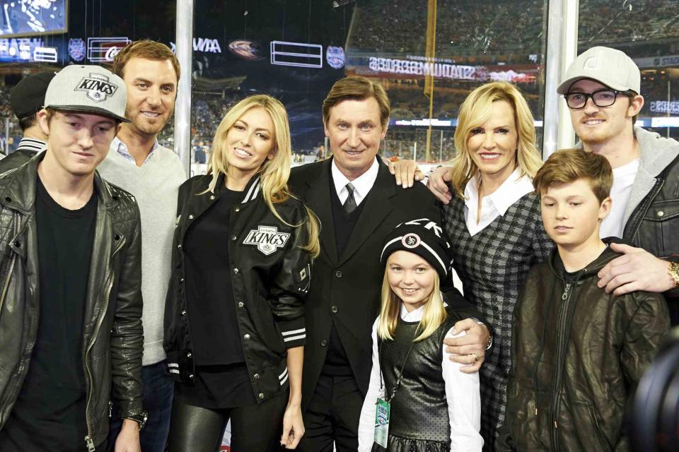 <p>Robert Beck /Sports Illustrated/Getty</p> Ty Gretzky, Dustin Johnson, Paulina Gretzky, Emma Gretzky, Janet Jones Gretzky, Wayne Gretzky, Tristan Gretzky and Trevor Gretzky in stands before a Dodgers game vs Anaheim Ducks on January 25, 2014.