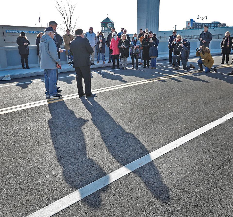 Governor Charlie Baker helps Quincy Mayor Tom Koch open the Generals Bridge in Quincy Center on Thursday, Jan. 13, 2022.