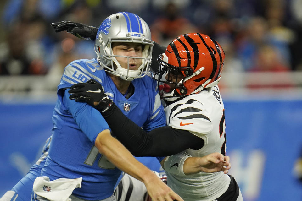 Detroit Lions quarterback Jared Goff (16) is pressured by Cincinnati Bengals safety Vonn Bell during the first half of an NFL football game, Sunday, Oct. 17, 2021, in Detroit. (AP Photo/Paul Sancya)
