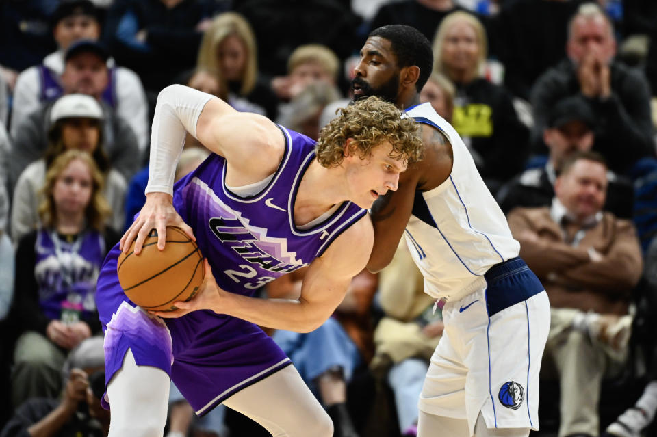 SALT LAKE CITY, UTAH - MARCH 25: Lauri Markkanen #23 of the Utah Jazz in action with Kyrie Irving #11 of the Dallas Mavericks during the second half of a game at Delta Center on March 25, 2024 in Salt Lake City, Utah. NOTE TO USER: User expressly acknowledges and agrees that, by downloading and or using this photograph, User is consenting to the terms and conditions of the Getty Images License Agreement. (Photo by Alex Goodlett/Getty Images)