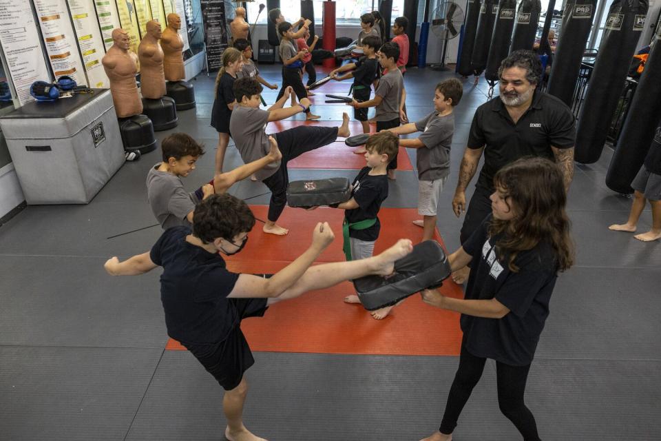 Woodland Hills, CA, Thursday, September 8, 2022 - Team Karate Center owner, Fariborz Azhakh, teaches children.