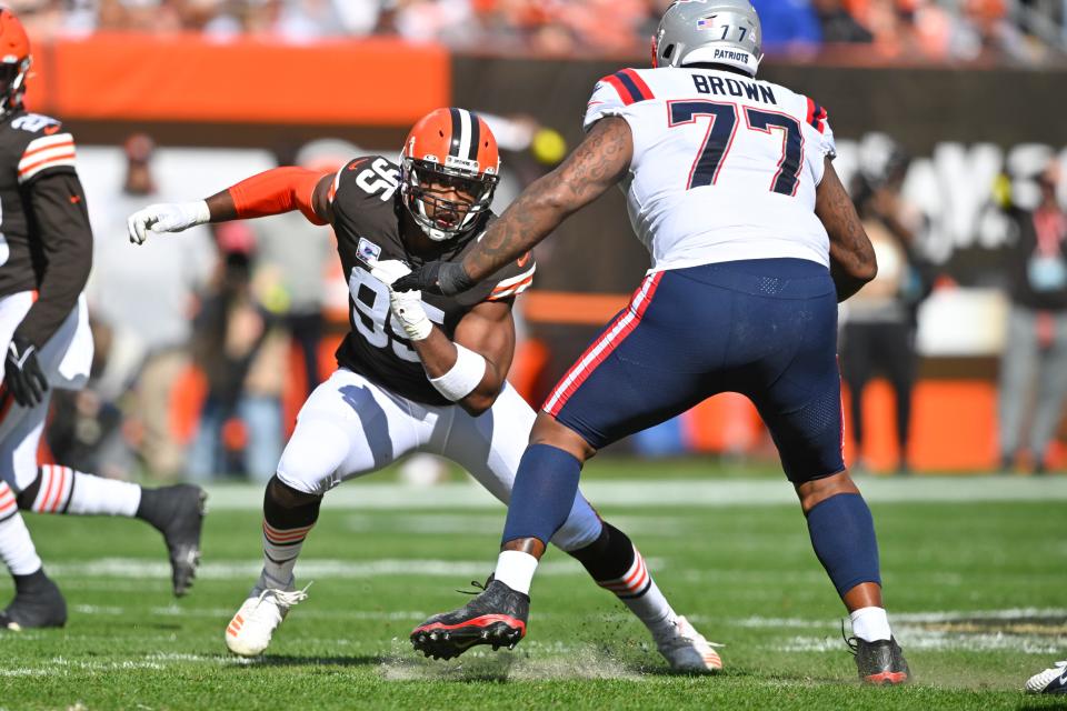 Browns defensive end Myles Garrett tries to get around New England Patriots offensive tackle Trent Brown (77) during the first half, Sunday, Oct. 16, 2022, in Cleveland.