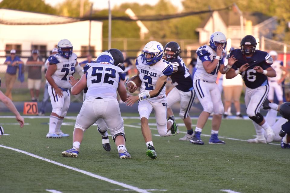 Croswell-Lexington's Gavin Espinoza carries the ball on a quarterback keeper during a game earlier this season. He threw for 21 touchdowns and ran for eight scores.