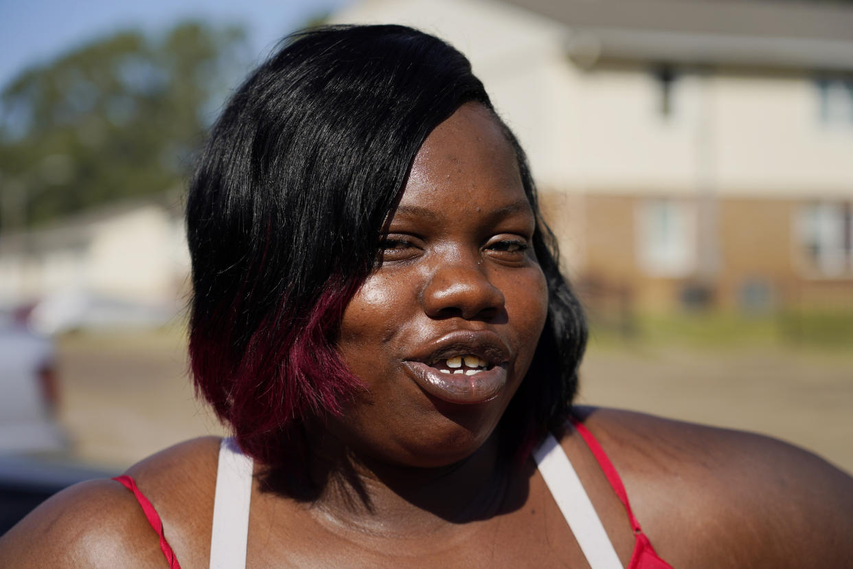 April Jackson stands outside her Jackson, Miss., apartment Oct. 5, 2022, and tells about the bureaucratic headaches she encountered as a single mother to collect a modest amount of Temporary Assistance for Needy Families (TANF) funds to help support her children who range in age from a few months to 13 years old. Funds from the program designed to help low-income families with children achieve economic self-sufficiency, were misspent and lawmakers are seeking to gain a better understanding of the welfare scandal. (AP Photo/Rogelio V. Solis)