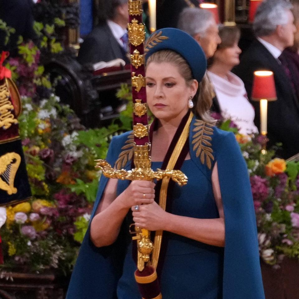 Mordaunt was required to carry the 17th-Century Sword of State into the Abbey in the King's Procession - VICTORIA JONES/AFP