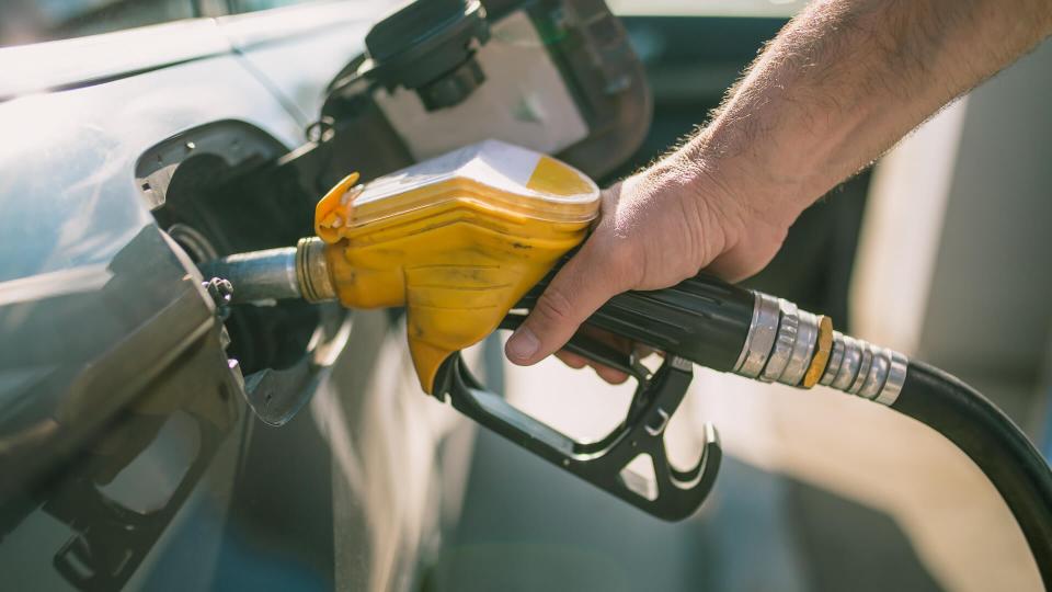 Car refueling on petrol station.