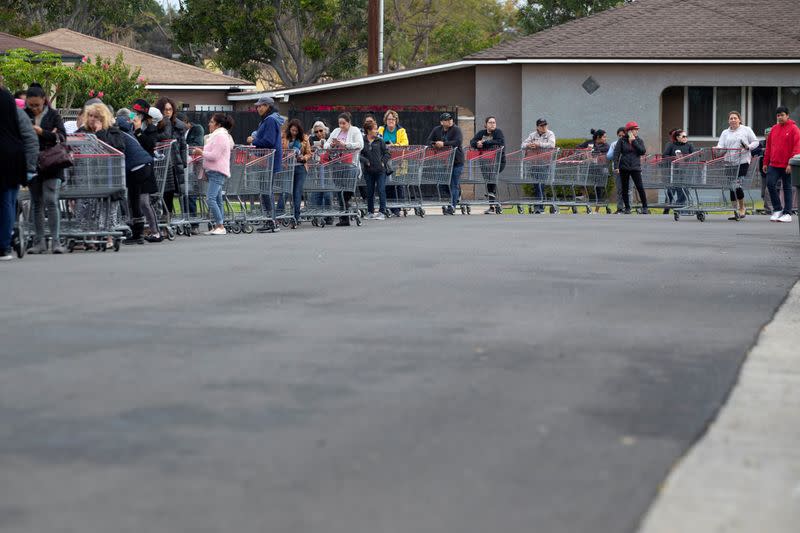 Hundreds of shoppers line-up for blocks waiting to purchase supplies at a Costco due to the global outbreak of coronavirus in Garden Grove, California
