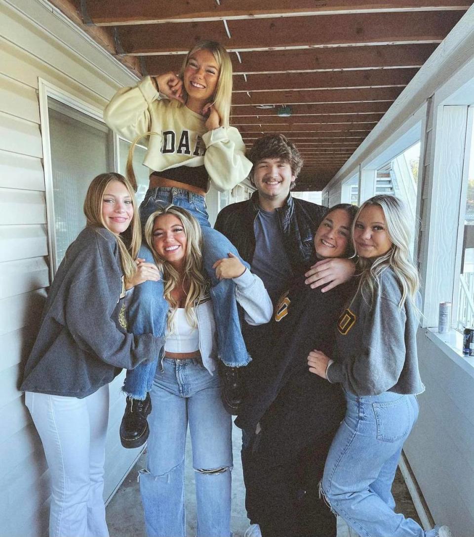 The four victims in the mass killing at the University of Idaho pose for a photo with their two roommates. At top left is Madison Mogen, 21, who is on the shoulders of Kaylee Goncalves, also 21. Ethan Chapin, 20, has his arm around Xana Kernodle, 20, his girlfriend.