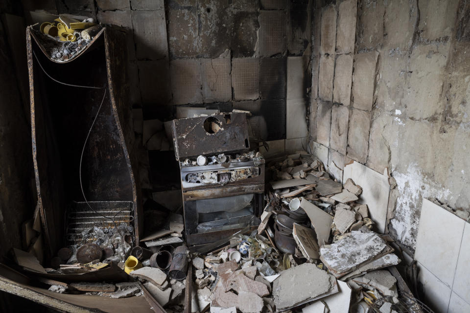 Debris cover the kitchen of an apartment damaged during shelling in Kharkiv, eastern Ukraine, Saturday, May 21, 2022. (AP Photo/Bernat Armangue)