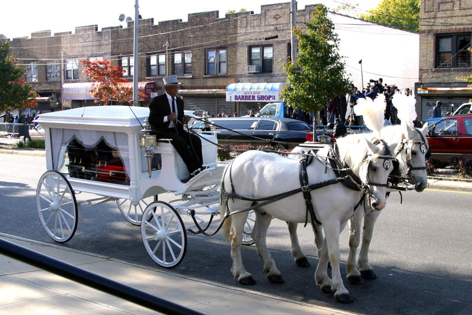 Jam Master Jay coffin in a white horse drawn carriage. (James Devaney / WireImage)