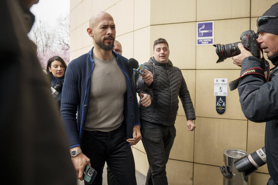 Andrew Tate arrives at the Bucharest Tribunal in Bucharest, Romania, Friday, March 15, 2024. A court in Romania’s capital on Wednesday extended geographical restrictions against online influencer Andrew Tate, who is awaiting trial on charges of human trafficking, rape and forming a criminal gang to sexually exploit women. (AP Photo/Andreea Alexandru)