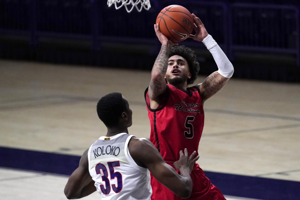 Eastern Washington guard Casson Rouse shoots over Arizona center Christian Koloko (35) during the second half of an NCAA college basketball game, Saturday, Dec. 5, 2020, in Tucson, Ariz. (AP Photo/Rick Scuteri)