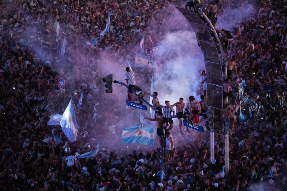 Argentine soccer fans celebrate their team's World Cup victory over France in downtown Buenos Aires, Argentina, Sunday, Dec. 18, 2022. (AP Photo/Rodrigo Abd)