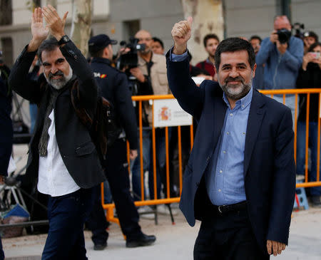 Jordi Cuixart (L), leader of Omnium Cultural, and Jordi Sanchez of the Catalan National Assembly (ANC), arrive to the High Court in Madrid, Spain, October 16, 2017. REUTERS/Javier Barbancho