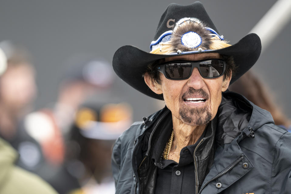 FILE - Seven-time NASCAR Cup Series champion Richard Petty looks on prior to an auto race at Darlington Raceway, Sunday, May 8, 2022, in Darlington, S.C. Petty Enterprises, an emblem of NASCAR since shortly after the series' 1948 formalization, has rebranded once again and is now Legacy Motor Club and co-owned by Jimmie Johnson, who will sometimes drive and this week attempt to qualify for the Daytona 500. (AP Photo/Matt Kelley, File)