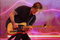 Keith Urban performs at the 56th annual Academy of Country Music Awards on Saturday, April 17, 2021, at the Grand Ole Opry in Nashville, Tenn. The awards show airs on April 18 with both live and prerecorded segments. (AP Photo/Mark Humphrey)